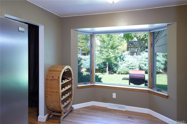 3820 S Harlan St, Denver, CO 80235 - unfurnished dining area featuring wood finished floors and baseboards