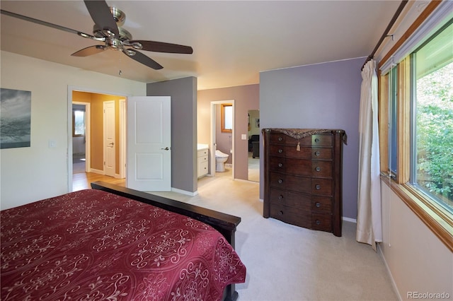 3820 S Harlan St, Denver, CO 80235 - bedroom with light colored carpet, ensuite bathroom, and ceiling fan