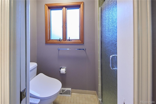 3820 S Harlan St, Denver, CO 80235 - bathroom with baseboards and a shower stall