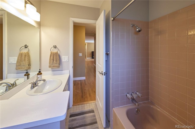 3820 S Harlan St, Denver, CO 80235 - full bathroom featuring shower / washtub combination, vanity, and tile patterned flooring