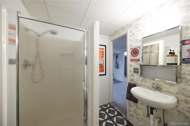 3820 S Harlan St, Denver, CO 80235 - bathroom with a shower stall, wallpapered walls, and a paneled ceiling
