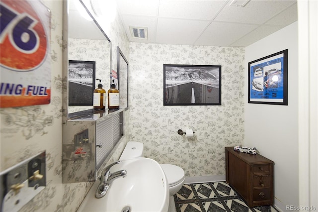 3820 S Harlan St, Denver, CO 80235 - bathroom featuring wallpapered walls and a drop ceiling