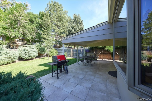 3820 S Harlan St, Denver, CO 80235 - fenced backyard with a grill, a patio area, and outdoor dining space