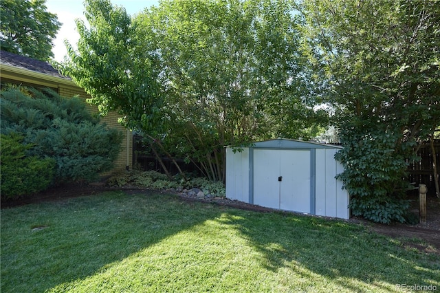 3820 S Harlan St, Denver, CO 80235 - view of grassy yard featuring a storage unit