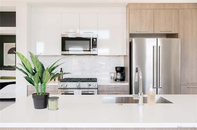 2880 Zuni St Unit 404, Denver, CO 80211 - kitchen with appliances with stainless steel finishes, modern cabinets, and light countertops