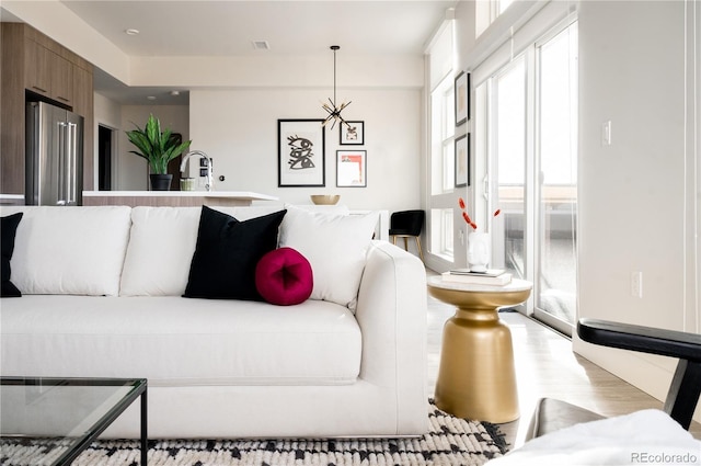 2880 Zuni St Unit 404, Denver, CO 80211 - living room featuring wood finished floors