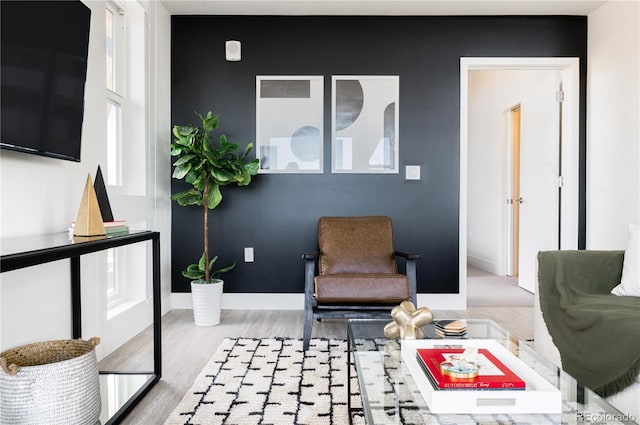 2880 Zuni St Unit 404, Denver, CO 80211 - sitting room featuring wood finished floors and baseboards