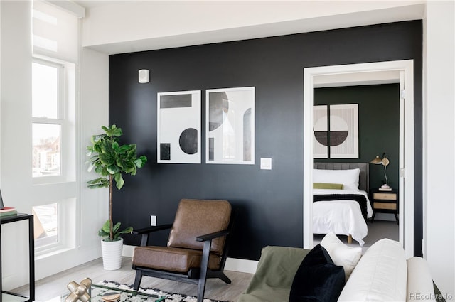 2880 Zuni St Unit 404, Denver, CO 80211 - sitting room featuring wood finished floors and baseboards