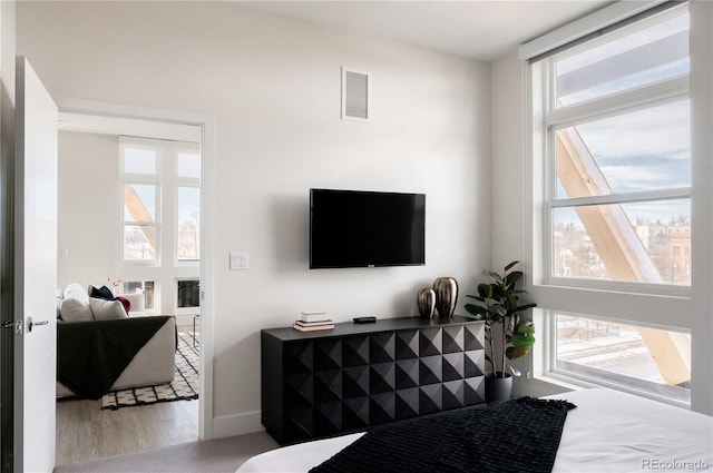 2880 Zuni St Unit 404, Denver, CO 80211 - bedroom featuring multiple windows and wood finished floors
