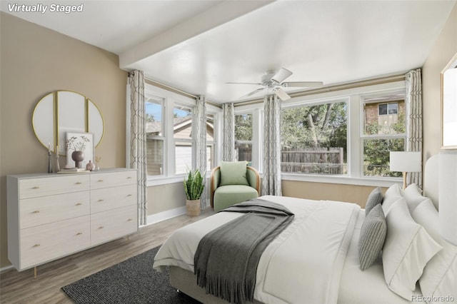 bedroom featuring ceiling fan and light wood-type flooring