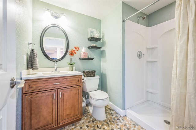 9361 Crestmore Way, Highlands Ranch, CO 80126 - bathroom featuring a textured wall, a shower stall, toilet, vanity, and baseboards