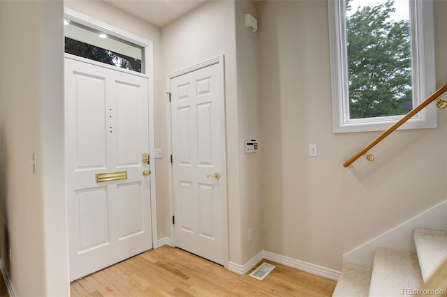 490 Jackson St, Denver, CO 80206 - entryway featuring stairway, light wood finished floors, and baseboards