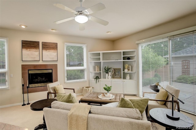 490 Jackson St, Denver, CO 80206 - carpeted living room featuring baseboards, a fireplace, plenty of natural light, and ceiling fan