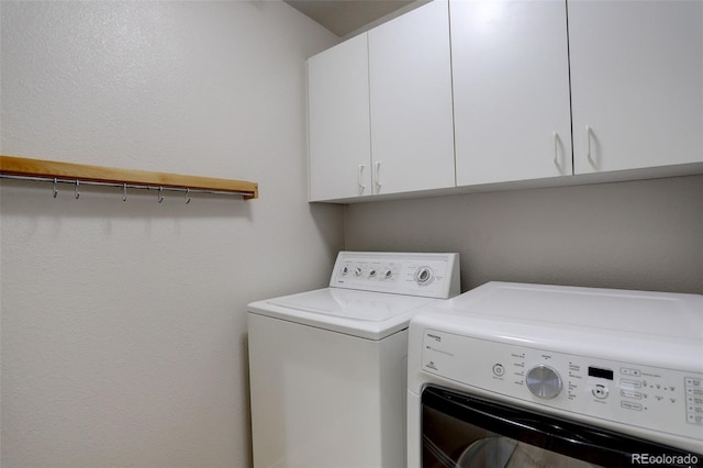 490 Jackson St, Denver, CO 80206 - laundry room with washer and clothes dryer and cabinet space