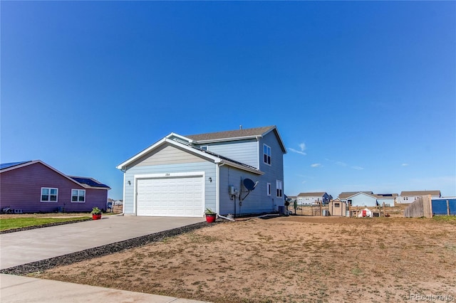 view of property exterior featuring driveway and a garage