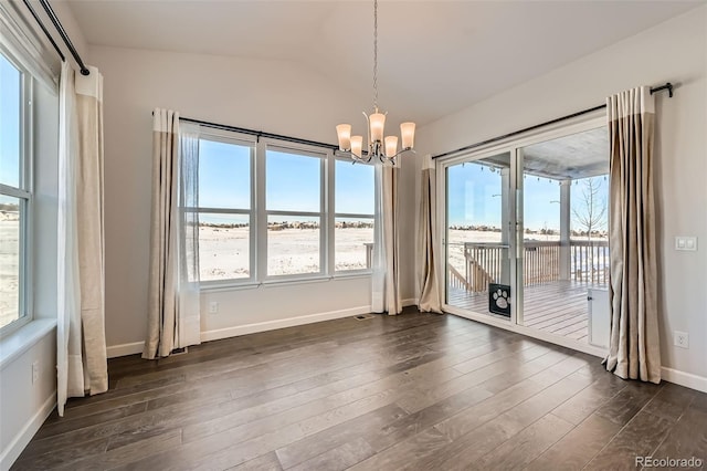 unfurnished dining area with a water view, a chandelier, and dark hardwood / wood-style floors