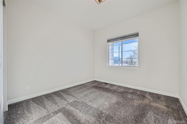 unfurnished room featuring carpet flooring