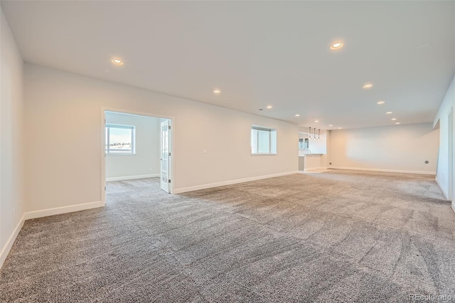 unfurnished room featuring carpet flooring