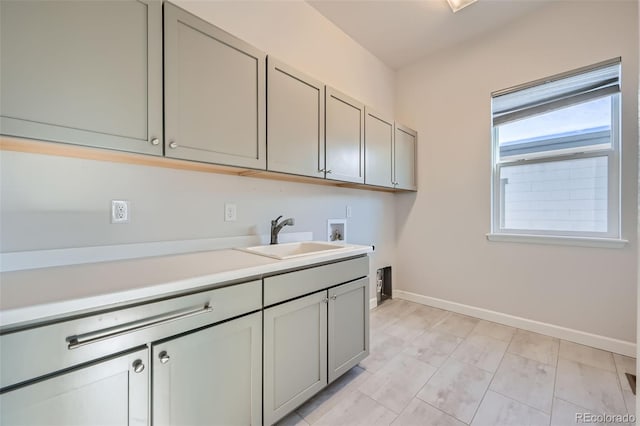 laundry room with cabinets, sink, and hookup for a washing machine