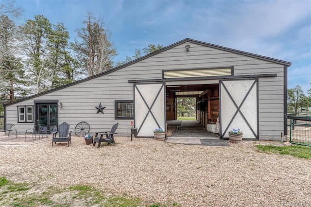 back of house with an outdoor structure