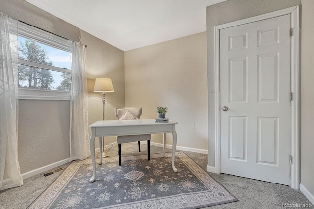 office with baseboards and visible vents
