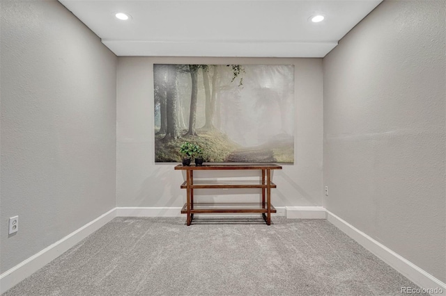 interior space with carpet floors, baseboards, and recessed lighting