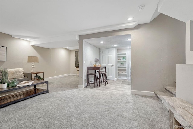 living area with stairs, recessed lighting, baseboards, and carpet