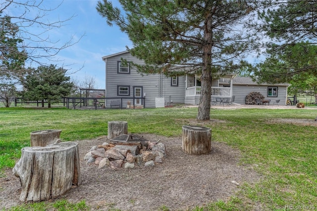 view of yard with a fire pit