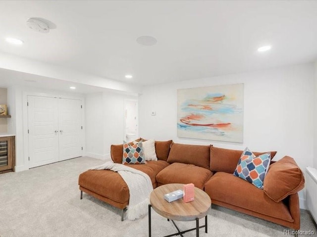 living room featuring recessed lighting, baseboards, and carpet