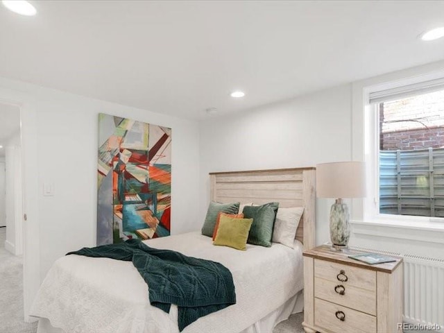 carpeted bedroom featuring recessed lighting