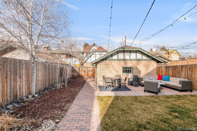 view of yard with a patio, outdoor lounge area, and a fenced backyard