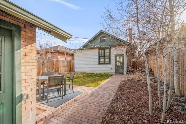 view of patio / terrace featuring outdoor dining area and fence