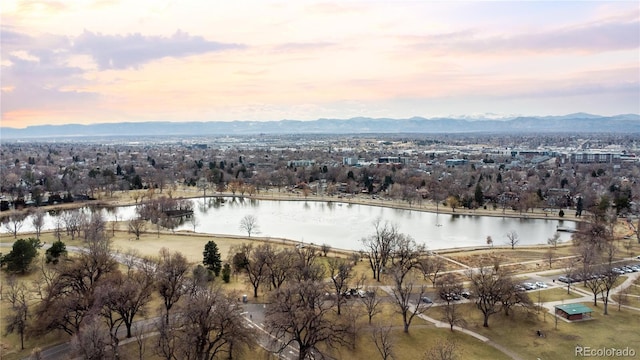 aerial view at dusk with a water and mountain view