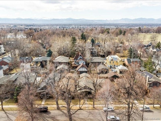 birds eye view of property featuring a mountain view and a residential view