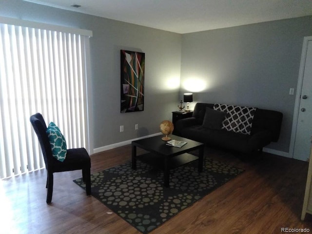 living room with dark hardwood / wood-style flooring