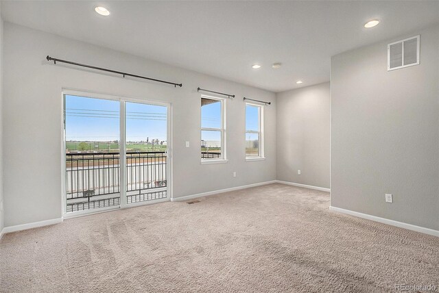 11250 Florence St Unit 29D, Commerce City, CO 80640 - carpeted spare room featuring recessed lighting, baseboards, and a water view