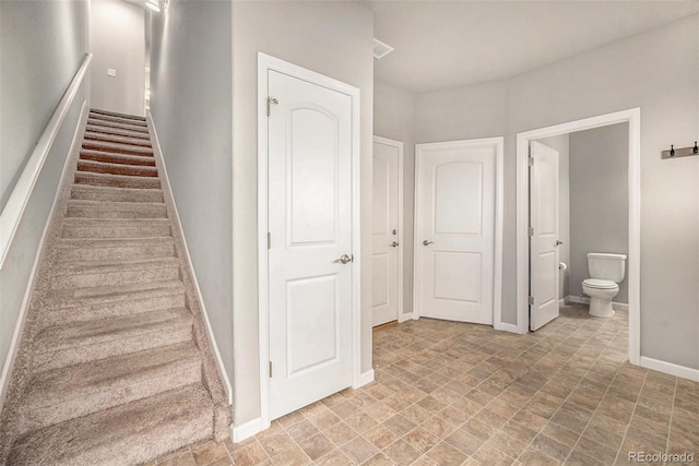11250 Florence St Unit 29D, Commerce City, CO 80640 - stairway with baseboards and stone finish floors
