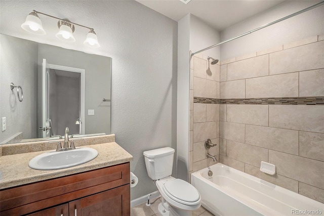 11250 Florence St Unit 29D, Commerce City, CO 80640 - bathroom with toilet, vanity, tub / shower combination, tile patterned flooring, and baseboards