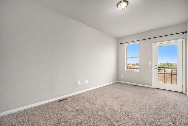 11250 Florence St Unit 29D, Commerce City, CO 80640 - unfurnished room featuring carpet and baseboards