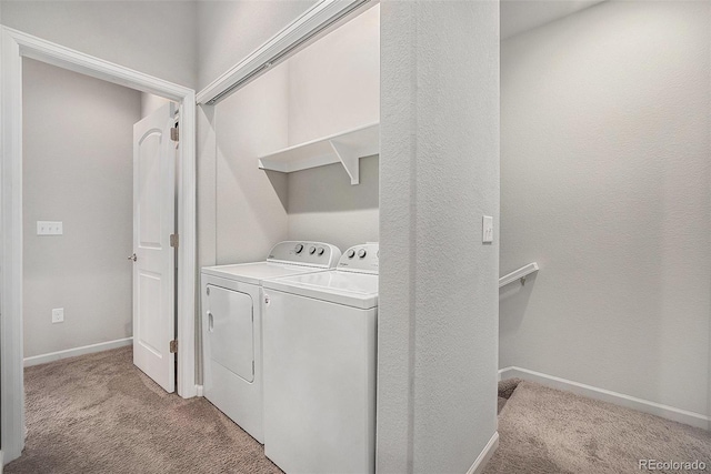 11250 Florence St Unit 29D, Commerce City, CO 80640 - laundry room with washer and clothes dryer, light colored carpet, and baseboards