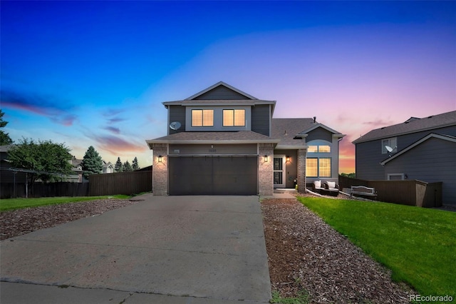 2695 Woodrose Pl, Highlands Ranch, CO 80129 - traditional-style house with driveway, an attached garage, brick siding, and a shingled roof