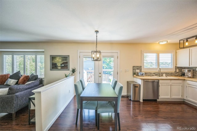 2695 Woodrose Pl, Highlands Ranch, CO 80129 - dining room featuring dark wood-style floors and a chandelier