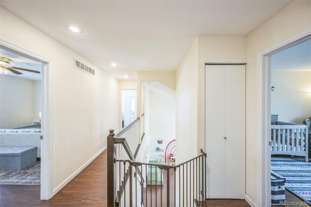 2695 Woodrose Pl, Highlands Ranch, CO 80129 - corridor with dark wood-style flooring and recessed lighting