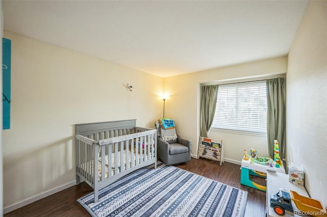 2695 Woodrose Pl, Highlands Ranch, CO 80129 - bedroom featuring wood finished floors and a crib