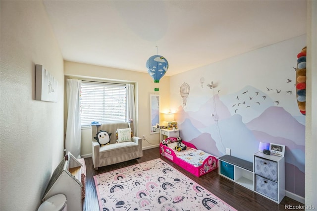 2695 Woodrose Pl, Highlands Ranch, CO 80129 - bedroom featuring wood finished floors and baseboards