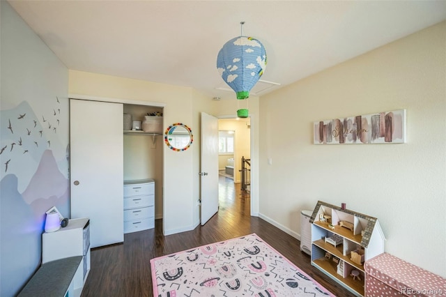 2695 Woodrose Pl, Highlands Ranch, CO 80129 - bedroom featuring wood finished floors and a closet