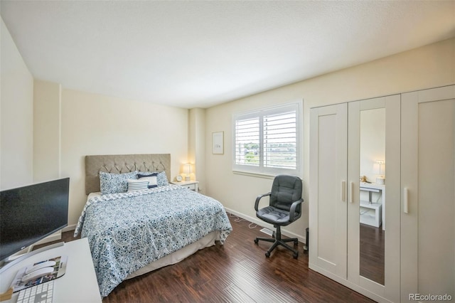 2695 Woodrose Pl, Highlands Ranch, CO 80129 - bedroom featuring dark wood-style floors and baseboards