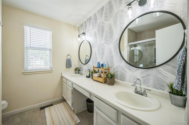2695 Woodrose Pl, Highlands Ranch, CO 80129 - bathroom with double vanity, an enclosed shower, and wallpapered walls