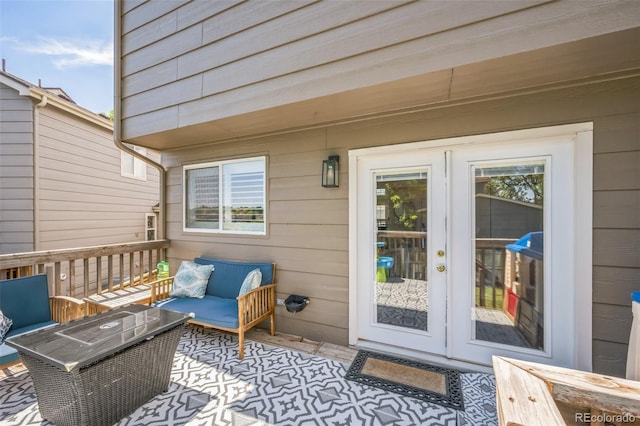 2695 Woodrose Pl, Highlands Ranch, CO 80129 - wooden terrace with french doors, an outdoor living space, and a patio area