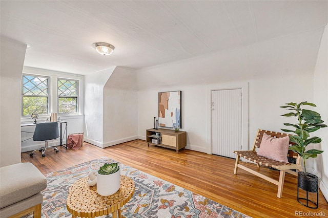 office featuring baseboards and light wood-style floors